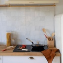 Ceranfeldschutz 1/2 schwarz, 50x28 cm, aus gehärtetem Glas